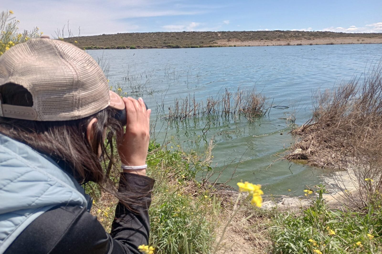 Agustina birdwatching at a lagoon